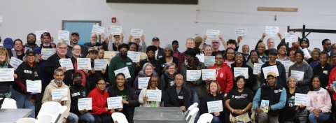 Group photo of Beloved Build 2024 participants pledging to build the Beloved Community with justice, equal opportunity, and love for all! 