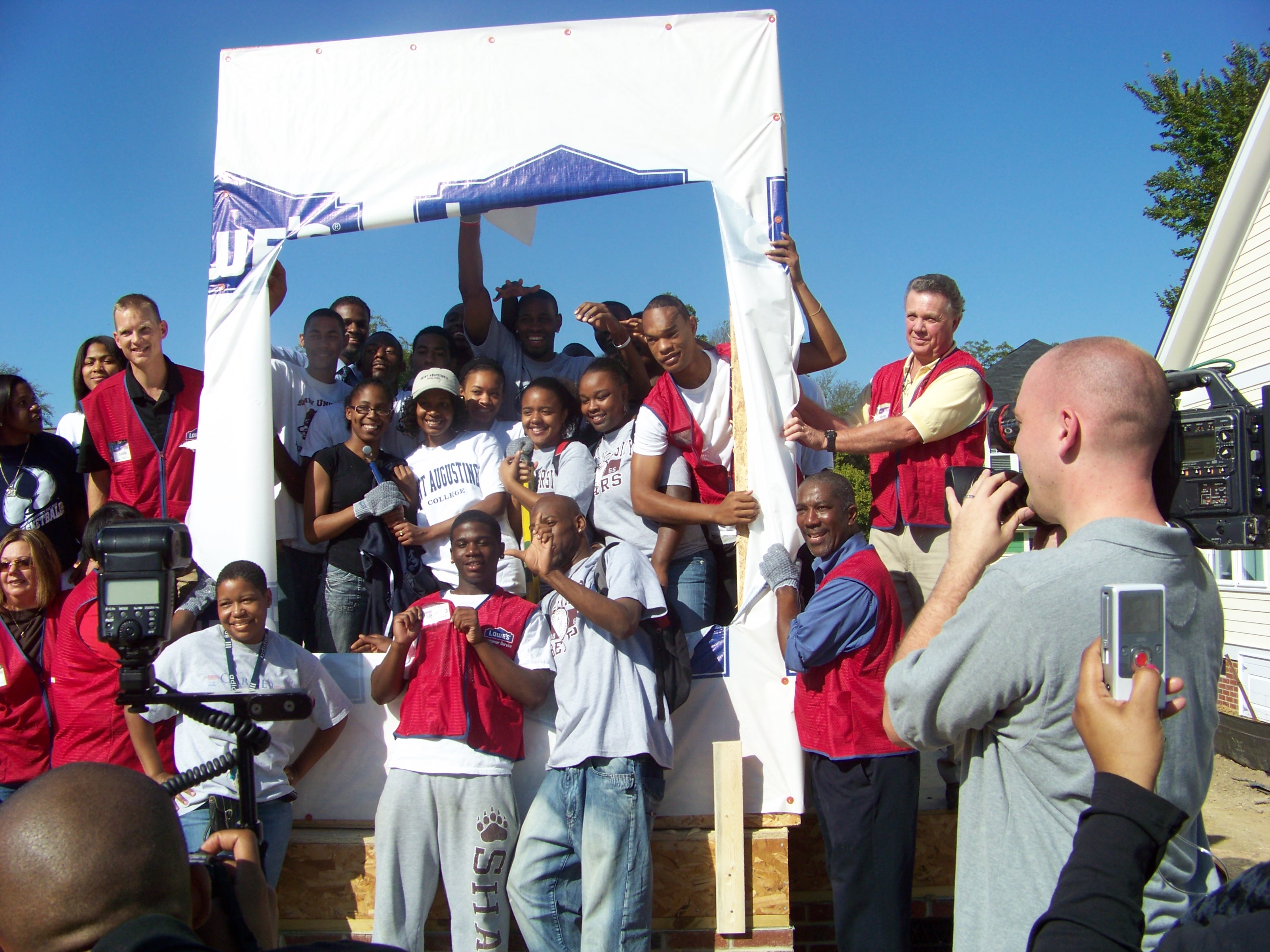 Students from St. Augustine's and Shaw on a site together