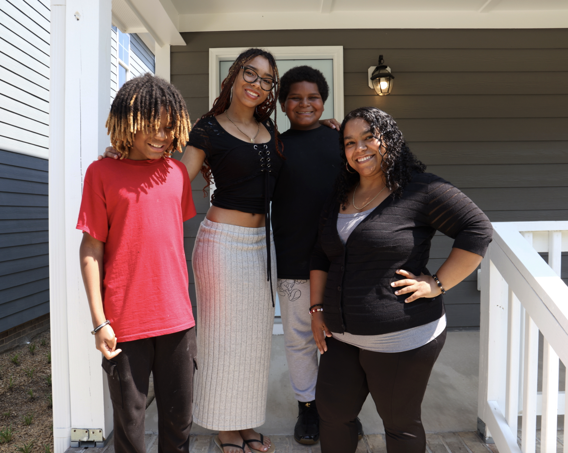 Rosemeri and her children on their porch