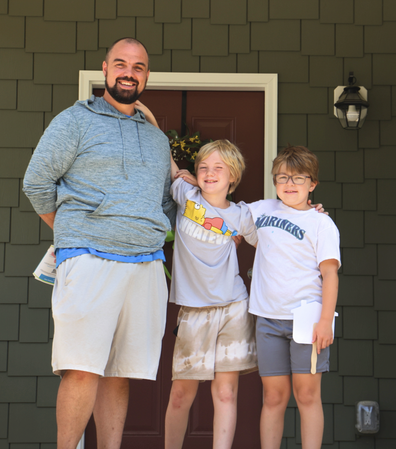 Sean and his children on their porch
