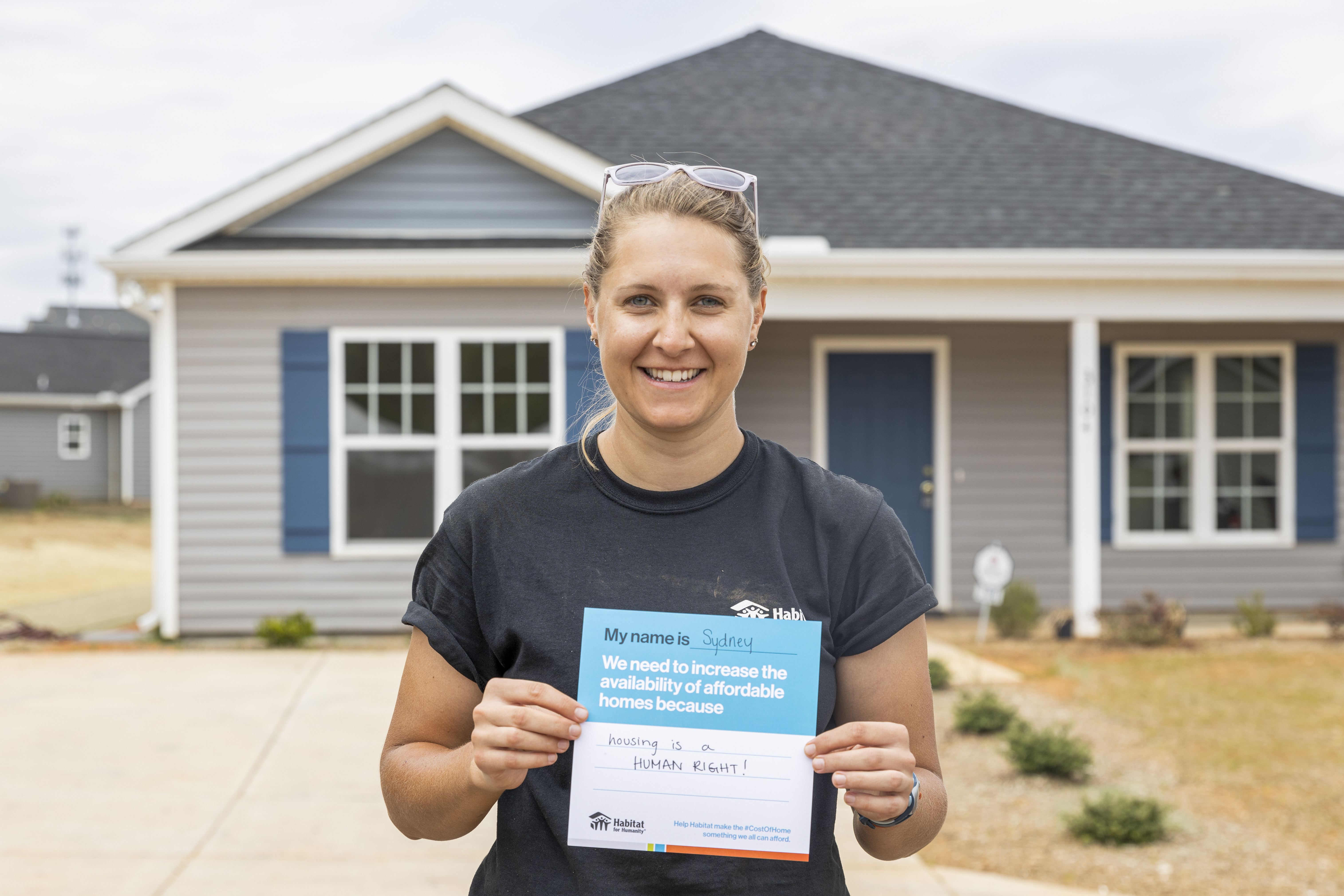 sign saying housing is a human right