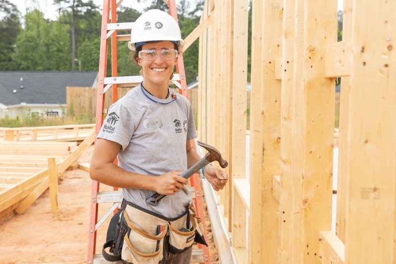 Habitat Wake Americorps member hammering