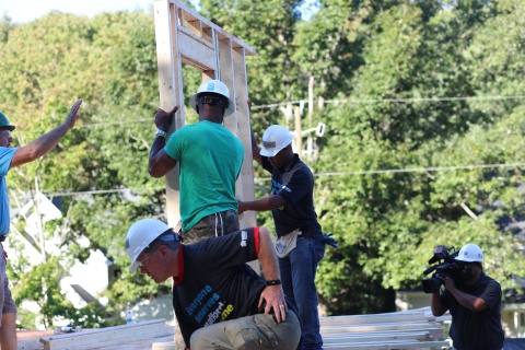Legislators putting up walls on a build site