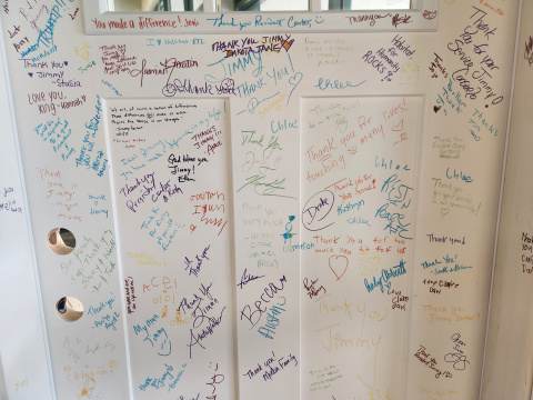 Jimmy Carter Legacy door full of colorful signatures and messages from the community