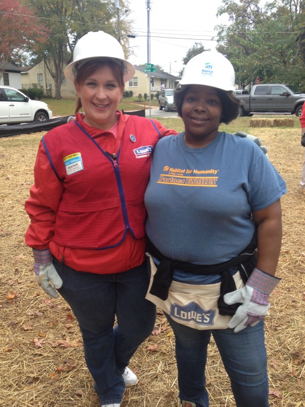 Lowe's employee with Habitat homeowner Latisha